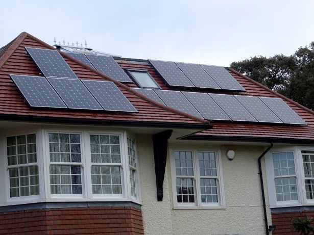 house with rooftop solar panels